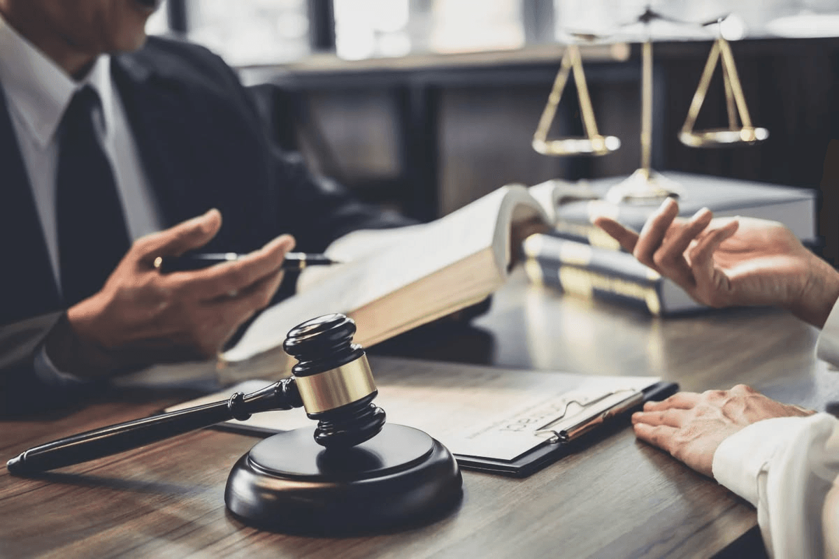Legal scales and a gavel on a desk